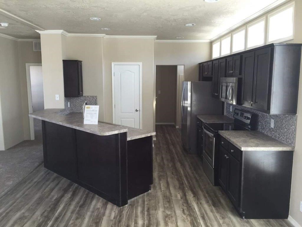 The ING682F MAPLE        (FULL) GW Kitchen. This Manufactured Mobile Home features 4 bedrooms and 2 baths.